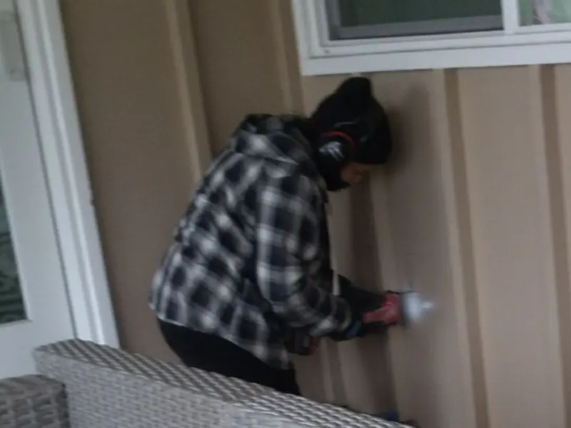 Professional electrician installing an exterior outlet in Madison